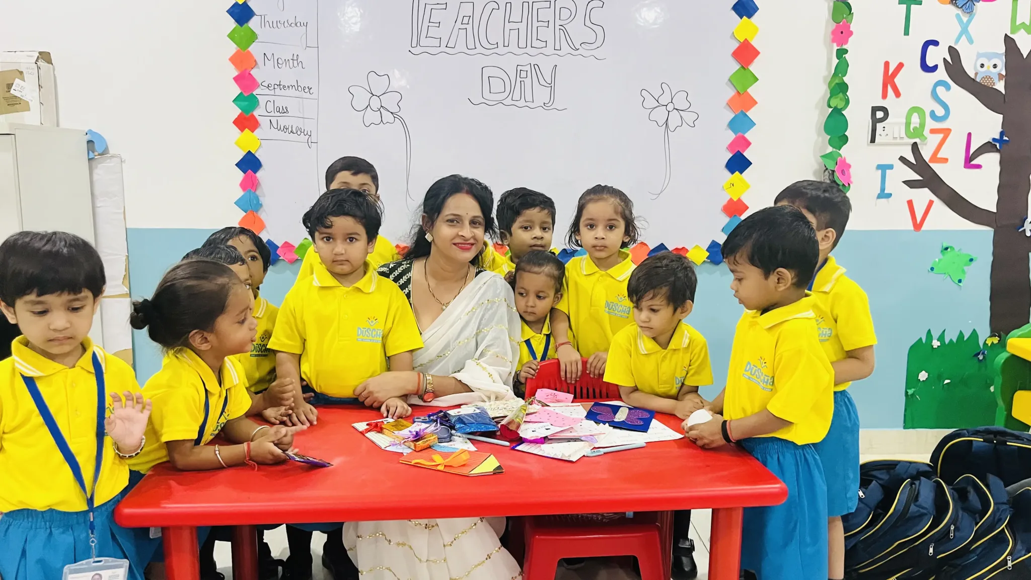 A teacher guiding children engaged in a fun group activity with hands-on participation