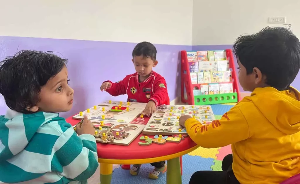 A preschool classroom in Ratan Khand Lucknow where children are learning about road safety with engaging activities.