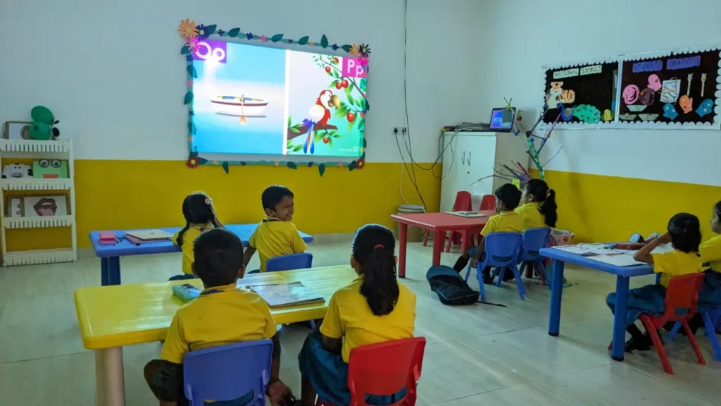 Children engaged in interactive activities in a daycare classroom, showcasing how daycare shapes lifelong learning through creative methods.